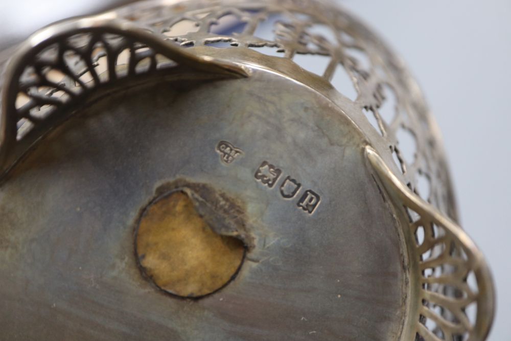 A George V pierced silver basket by Goldsmiths & Silversmiths Co Ltd, London, 1910 & a small silver coffee pot.